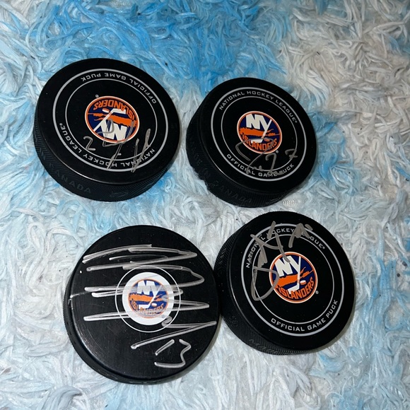 Other - 4 signed New York islander official pucks